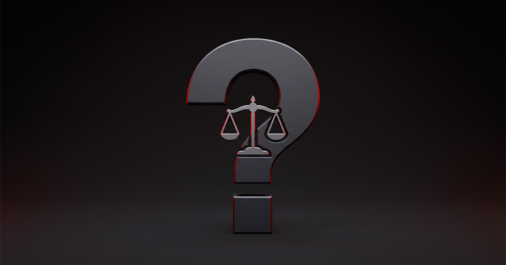 Question mark with balance scale at its center